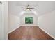 A spacious bedroom with vaulted ceilings, recessed lighting, and hardwood floors at 1920 Rocky Mill Ln, Lawrenceville, GA 30044