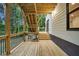 Wooden deck and stairs leading down to the yard, supported by wooden posts and beams at 1920 Rocky Mill Ln, Lawrenceville, GA 30044