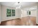 Bright dining room featuring wood floors, modern lighting and large windows with outside view at 1920 Rocky Mill Ln, Lawrenceville, GA 30044