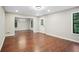 Spacious living room with wood floors, neutral walls, a white trim and plenty of natural light at 1920 Rocky Mill Ln, Lawrenceville, GA 30044