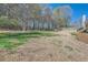 Large grassy backyard with plenty of room for outdoor activities and games at 3619 Elinburg Ne Ct, Buford, GA 30519
