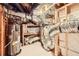 A basement featuring the hot water heater and the HVAC unit with exposed ductwork at 3619 Elinburg Ne Ct, Buford, GA 30519