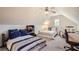 An attic bedroom with two beds, a window, and a drumset at 3619 Elinburg Ne Ct, Buford, GA 30519
