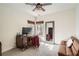 Bedroom with desk, a large mirror, and a small brown leather couch at 3619 Elinburg Ne Ct, Buford, GA 30519