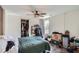 Bright bedroom with a large window, ample closet space, and a ceiling fan at 3619 Elinburg Ne Ct, Buford, GA 30519