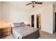 Bedroom features a window, a TV, and a view into the bathroom at 3619 Elinburg Ne Ct, Buford, GA 30519
