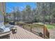 Wide deck overlooks backyard, with space for entertaining, and grilling area at 3619 Elinburg Ne Ct, Buford, GA 30519