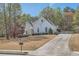 Beautiful single Gathering home boasting mature landscaping, a concrete drive, and neutral exterior at 3619 Elinburg Ne Ct, Buford, GA 30519