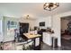 Well-lit kitchen with island, black appliances, and ample counter space at 3619 Elinburg Ne Ct, Buford, GA 30519