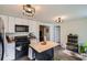 Modern kitchen featuring an island, stainless appliances, and plenty of storage at 3619 Elinburg Ne Ct, Buford, GA 30519