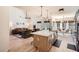 Bright, open kitchen with stainless steel appliances, and views into the living room at 3619 Elinburg Ne Ct, Buford, GA 30519