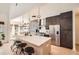 Modern kitchen with stainless steel appliances, a large island, and dark cabinets at 3619 Elinburg Ne Ct, Buford, GA 30519