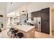 Modern kitchen with stainless steel appliances, large island with seating, and ample cabinet space at 3619 Elinburg Ne Ct, Buford, GA 30519