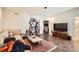 Cozy living room with comfortable seating, a modern TV, and a decorative rug at 3619 Elinburg Ne Ct, Buford, GA 30519