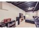 Cozy living room with exposed ceiling, modern television, and comfortable sectional at 3619 Elinburg Ne Ct, Buford, GA 30519