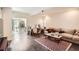 Cozy living room with a comfortable sofa, coffee table, and view into an office at 3619 Elinburg Ne Ct, Buford, GA 30519