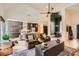Spacious living room featuring a vaulted ceiling and hardwood floors open to dining room and kitchen at 3619 Elinburg Ne Ct, Buford, GA 30519