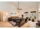 Open-concept living room with hardwood floors, high ceilings, and views of the home's backyard at 3619 Elinburg Ne Ct, Buford, GA 30519