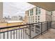 Condo balcony featuring black metal railing and scenic city views on a cloudy day at 620 Peachtree Ne St # 1413, Atlanta, GA 30308