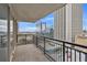 Condo balcony view of city skyline with black metal railing and sliding glass doors at 620 Peachtree Ne St # 1413, Atlanta, GA 30308