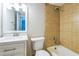 Bathroom features a white vanity with modern fixtures, tile shower, and an updated lighting fixture at 620 Peachtree Ne St # 1413, Atlanta, GA 30308