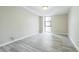 Bright bedroom with light gray vinyl flooring and a large window with city views at 620 Peachtree Ne St # 1413, Atlanta, GA 30308