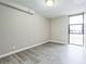 Bedroom with large windows offering city views and wood flooring at 620 Peachtree Ne St # 1413, Atlanta, GA 30308