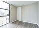 Bedroom with large windows offering city views and wood flooring at 620 Peachtree Ne St # 1413, Atlanta, GA 30308