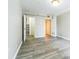 Bright bedroom with light gray vinyl flooring, a closet and a white interior door at 620 Peachtree Ne St # 1413, Atlanta, GA 30308