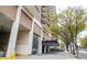 Building exterior showcasing an urban high-rise apartment building with balconies and street view at 620 Peachtree Ne St # 1413, Atlanta, GA 30308
