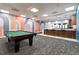 Recreation room with a billiard table, modern mural, bar with bar stools, and overhead lighting at 620 Peachtree Ne St # 1413, Atlanta, GA 30308