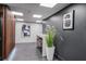 Hallway with modern design, stylish decorations, and a long white table with bar stools at 620 Peachtree Ne St # 1413, Atlanta, GA 30308