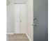 Hallway featuring wood floors, painted doors, and modern hardware at 620 Peachtree Ne St # 1413, Atlanta, GA 30308