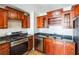Kitchen featuring dark cabinets, granite countertops, and stainless steel appliances at 620 Peachtree Ne St # 1413, Atlanta, GA 30308