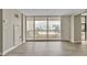Spacious living room with floor to ceiling window and balcony overlooking city at 620 Peachtree Ne St # 1413, Atlanta, GA 30308