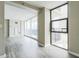 Living room with floor to ceiling windows and balcony overlooking city at 620 Peachtree Ne St # 1413, Atlanta, GA 30308