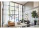 Elegant lobby with high ceilings, large windows, stylish furniture, and sophisticated lighting fixtures at 620 Peachtree Ne St # 1413, Atlanta, GA 30308
