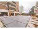 Relaxing outdoor pool area with lounge chairs and tables, perfect for enjoying the summer months at 620 Peachtree Ne St # 1413, Atlanta, GA 30308