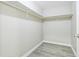 Walk-in closet with shelving and wood flooring at 620 Peachtree Ne St # 1413, Atlanta, GA 30308