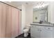 Well-lit bathroom with a shower-tub combination and vanity with granite counters at 847 Venture Sw Way, Atlanta, GA 30331