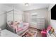 Bright bedroom features a four-post bed and light gray walls and trim at 847 Venture Sw Way, Atlanta, GA 30331