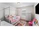 Charming bedroom with a delightful canopy bed and playful decor at 847 Venture Sw Way, Atlanta, GA 30331
