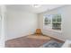 Neutral bedroom offers natural light, carpet, and a cozy atmosphere at 847 Venture Sw Way, Atlanta, GA 30331