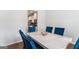 Elegant dining room featuring a marble table and stylish blue chairs at 847 Venture Sw Way, Atlanta, GA 30331