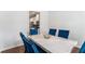 Elegant dining room featuring a marble table and plush velvet chairs at 847 Venture Sw Way, Atlanta, GA 30331
