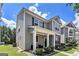 Side view of a well-maintained two-story home with a covered porch and green lawn at 847 Venture Sw Way, Atlanta, GA 30331