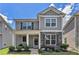 Charming two-story home with stone accents, a cozy front porch, and well-manicured landscaping at 847 Venture Sw Way, Atlanta, GA 30331