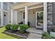 Inviting front porch with seating and tasteful landscaping at 847 Venture Sw Way, Atlanta, GA 30331