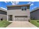 Home featuring a spacious two-car garage and a well-maintained lawn at 847 Venture Sw Way, Atlanta, GA 30331
