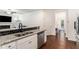 Open concept kitchen with stainless steel appliances, granite counters, and a view to the living room at 847 Venture Sw Way, Atlanta, GA 30331